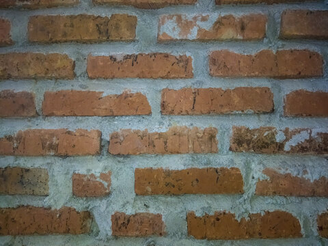 A beautiful wall made of hand-carved red brick; it makes an excellent background