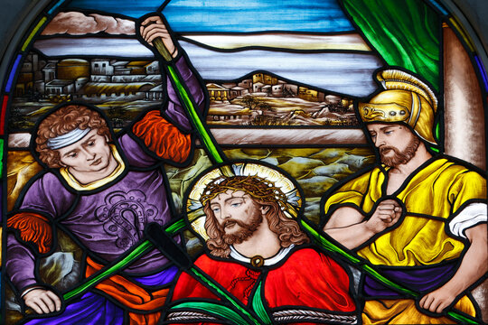 Stained glass depiction of the crowning with thorns in the context of the Passion of Christ in a church in Vietnam