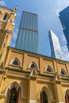 View of St Johns Cathedral surrounded by modern buildings in Central District, Hong Kong Island, Hong Kong, China