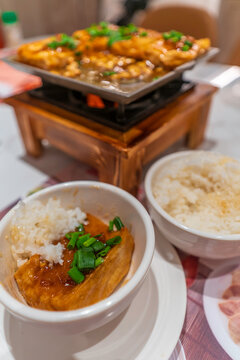 Pan fried tofu served with rice in a traditional setting on Hong Kong Island