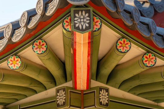 Detail of Daehanmun Gate showing traditional design elements at Deoksugung Palace in Jung District of Seoul, South Korea in bright daylight