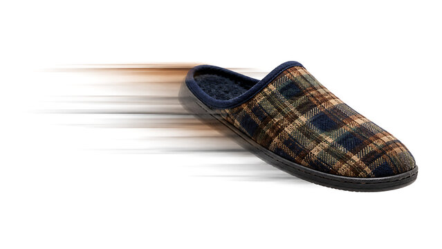 Plaid winter slipper sliding fast with motion blur isolated on a white background