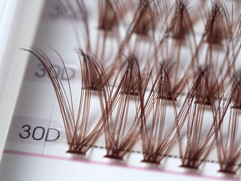 False eyelashes extension set with brown lashes. Makeup accessories