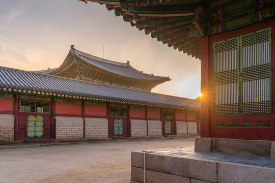 Golden sunset view of Gyeongbokgung Palace highlighting traditional architecture in Seoul, South Korea