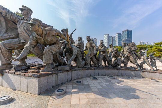 Sculptures representing soldiers and history at War Memorial of Korea in Seoul on a sunny day