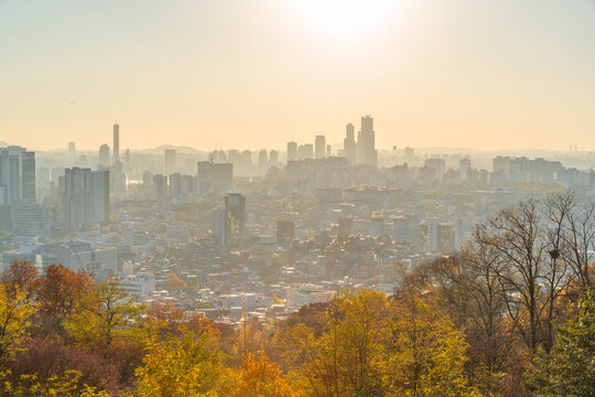 View of Seoul skyline from N Seoul Tower at golden hour in autumn over Yongsan District in South Korea