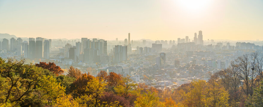 View of Seoul skyline from N Seoul Tower at golden hour during autumn in Yongsan District, South Korea