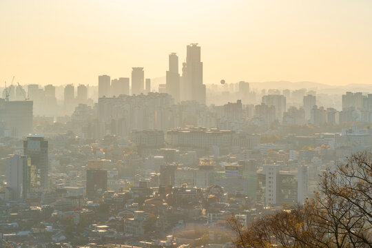 Seoul skyline view from N Seoul Tower during autumn golden hour in Yongsan District, South Korea