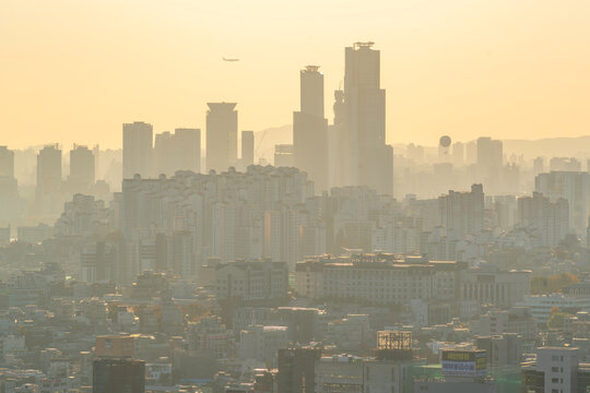 View of Seoul skyline from N Seoul Tower at golden hour in autumn, Yongsan District, South Korea