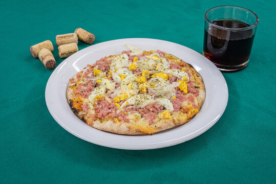 Brazilian pizza Portuguesa - Portuguese pizza and soft drink