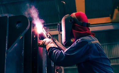 Welding steel structures and bright sparks in construction industry. © nuttawutnuy