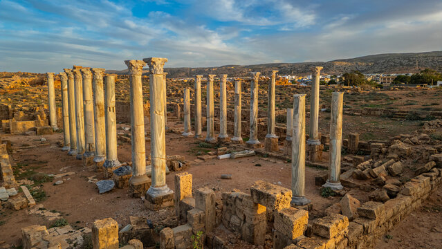 Ruins of ancient Apollonia in Cyrenaica showcase historical Greek architecture in Eastern Libya under a sky filled with clouds