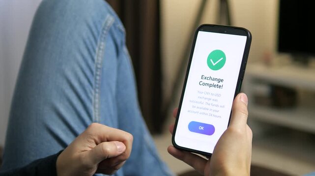 User viewing an Exchange Complete success screen after converting CNY to USD. A green checkmark and clear confirmation message. Ideal for fintech success states, payment verification, and transaction