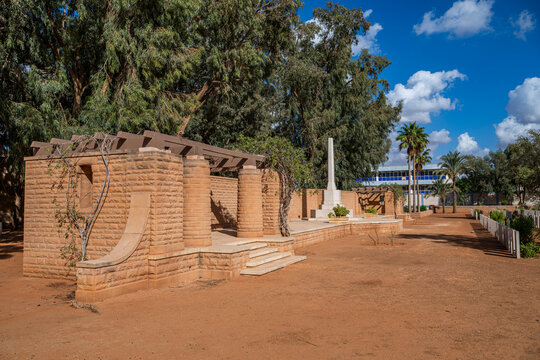 British World War 2 cemetery located in Benghazi Libya features memorial structures and greenery on a sunny day
