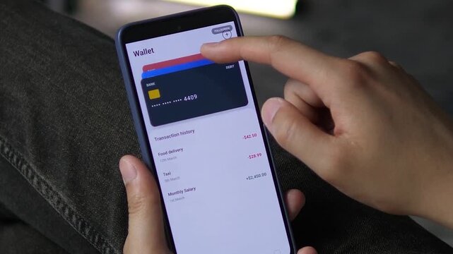 Mobile wallet app showing a dark debit card and transaction history. User taps to switch views and explore card details. Perfect for digital wallet UX, card management, and personal finance software.