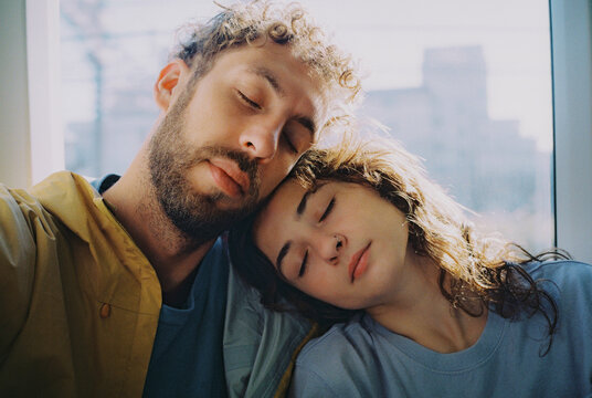 Couple sleeping in the moving train in Tokyo, Japan. Shot on film 