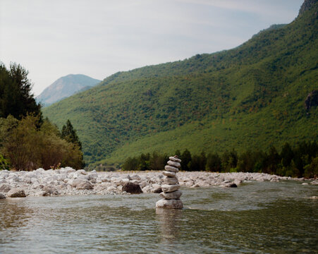 Stack of stones balanced in the river in Albania 