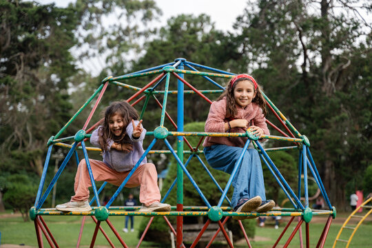 Children Playing Climbing in Park. 
