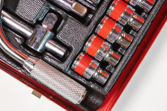 Close-up of socket wrench tool set on white background 
