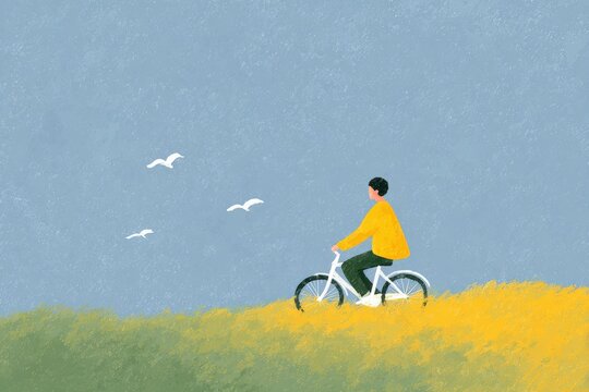A man riding a bicycle on top of a lush green field with a bright blue sky in the background and a flock of birds flying in the sky.