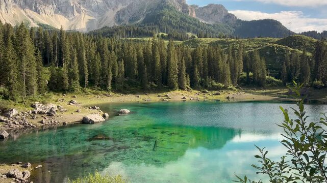 Lake Carezza Serene Wide Angle View, Turquoise Alpine Lake Reflecting Dolomite Peaks and Pine Forest South Tyrol Italy