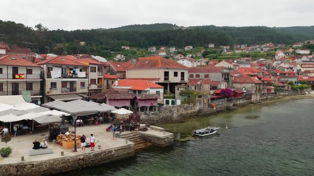 Aerial Drone View of the Coastline and Traditional Stone Horreos in the Historic Village of Combarro Galicia