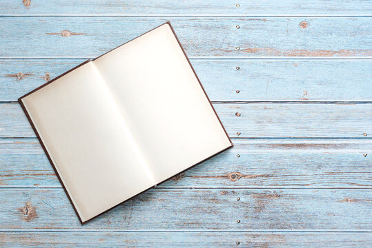 Top view of open book with space for text