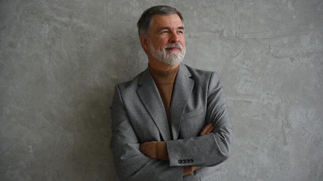 Success concept. Stylish bearded man in a suit in modern office