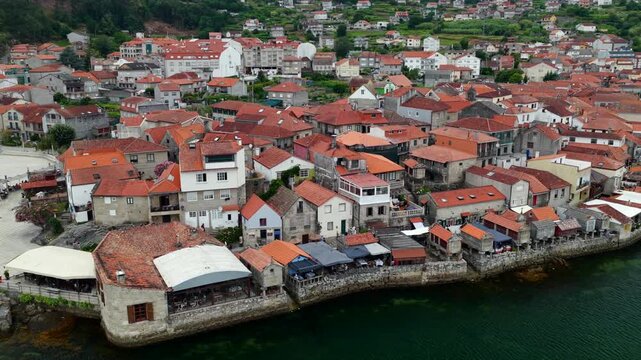 Aerial Drone View of the Coastline and Traditional Stone Horreos in the Historic Village of Combarro Galicia