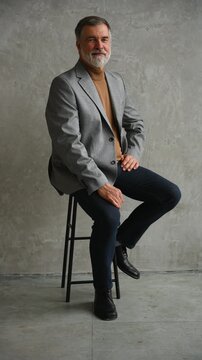 Success concept. Stylish bearded man in a suit in modern office