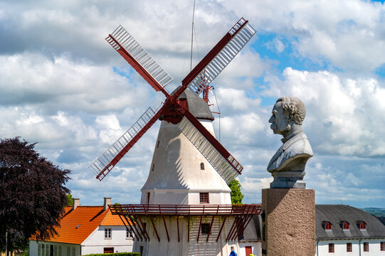 Dybbol Mill with the Christian IX bust on the Dybbol banke near Sonderborg, Denmark beneath a summer sky.