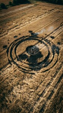 Aerial View of Circular Harvest Pattern in Wheat Field During Golden Hour