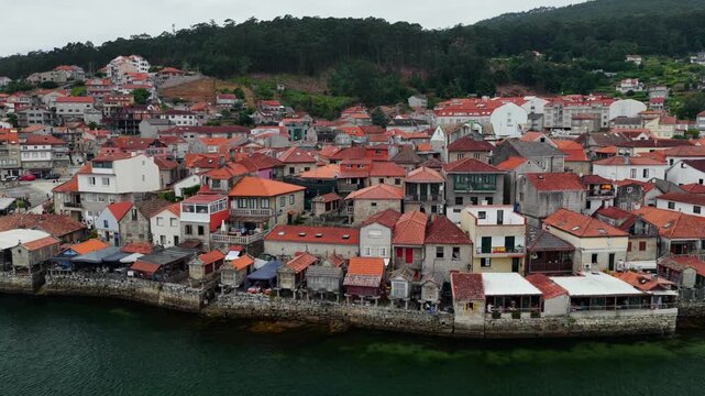 Aerial Drone View of the Coastline and Traditional Stone Horreos in the Historic Village of Combarro Galicia