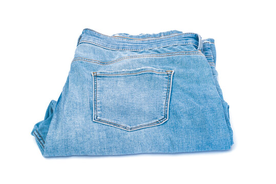 Blue jeans denim trousers close up isolated on white background