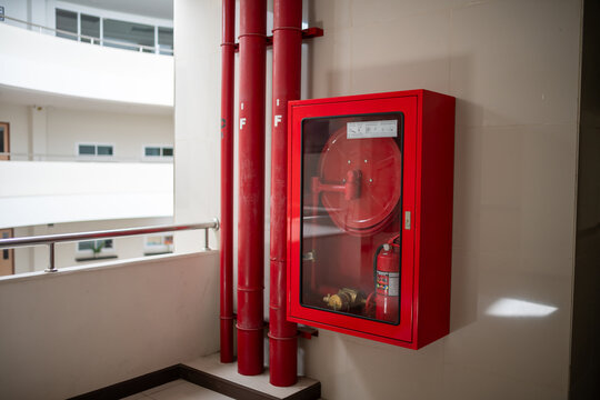 Red Fire Safety Cabinet on Wall in Building