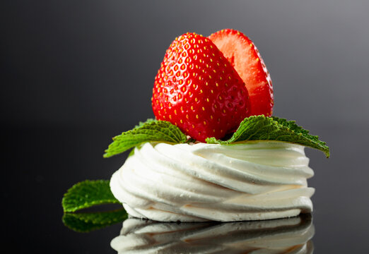 Pavlova dessert with strawberries and mint.
