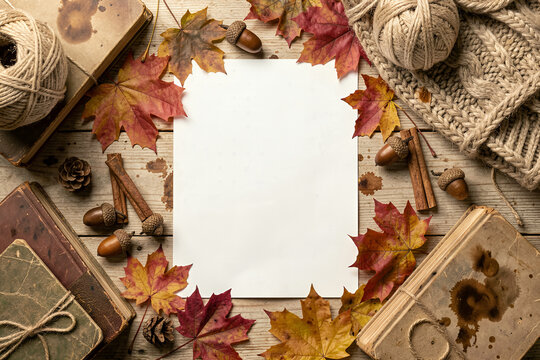 Autumn Flat Lay Composition with Maple Leaves, Acorns, and Cozy Rustic Elements