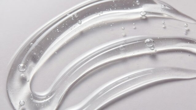 Clear gel with glossy finish, showcasing soft curves and shimmering bubbles.