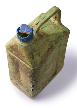 old dirty green plastic jerrycan isolated white background, weathered container with broken blue cap and mud stains, top view in close-up
