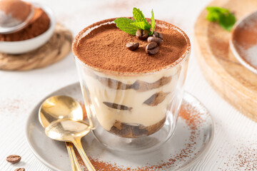 Classic Italian Tiramisu in Glass with Gold Spoon © anammarques