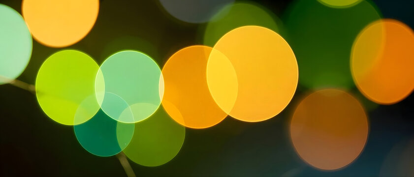 Vibrant Abstract Background Featuring Colorful Bokeh Circles of Light, Festive Golden and Green Glowing Orbs, Artistic Defocused Night Lights Texture for Digital Design Projects and