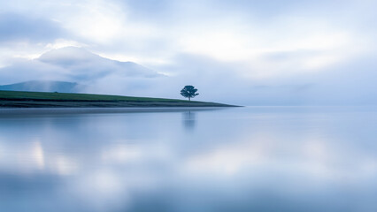 AI Generated Peaceful Lake Landscape Surrounded by Green Nature © FIGO