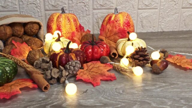 Festive thanksgiving decoration with pumpkins and autumn leaves