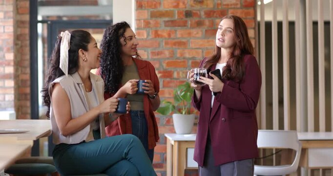 Diverse coworkers chatting on coffee break at office after speaker gesturing with press and phone