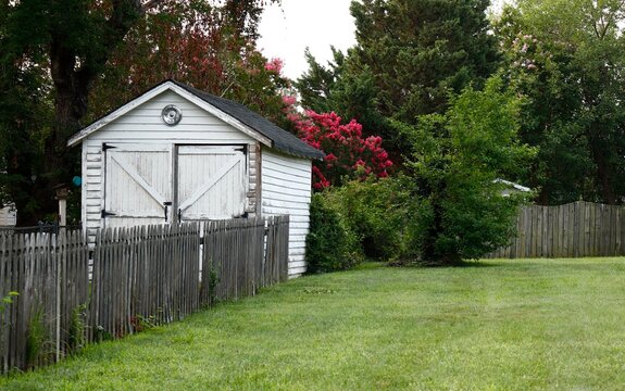 Quaint rustic-style white shed