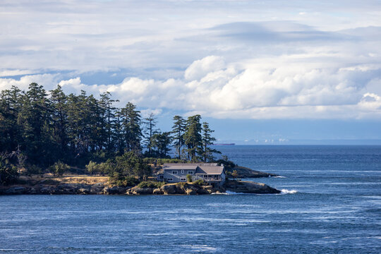 Coastal House on Galiano Island Overlooking the Pacific Ocean with Rocky Shoreline and Evergreens