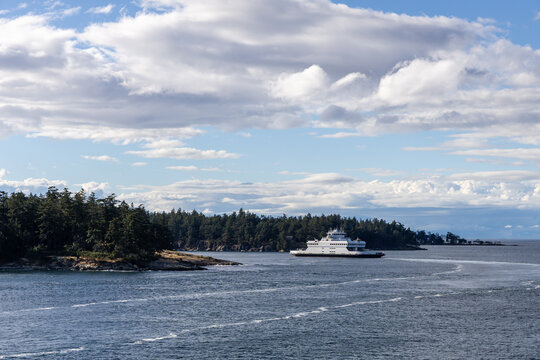 Ferry Passing Between Forested Islands on Galiano Island Coastline in British Columbia, Canada