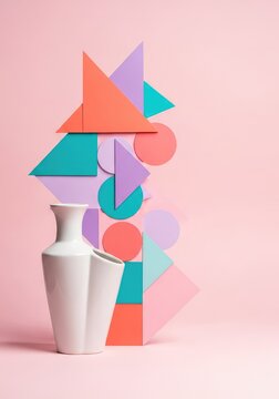 A soft pink pastel background featuring various geometric shapes such as triangles and circles arranged in a modern and minimalist design, translucent, minimalist, texture