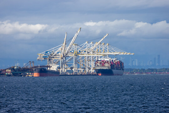 Container Port With Cranes and Cargo Ships at Tsawwassen Terminal, British Columbia, Canada