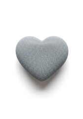 Fototapeta premium A natural grey rock meticulously sculpted into a perfect heart shape, resting alone on a clean white background with soft shadows beneath, element, romance, stability